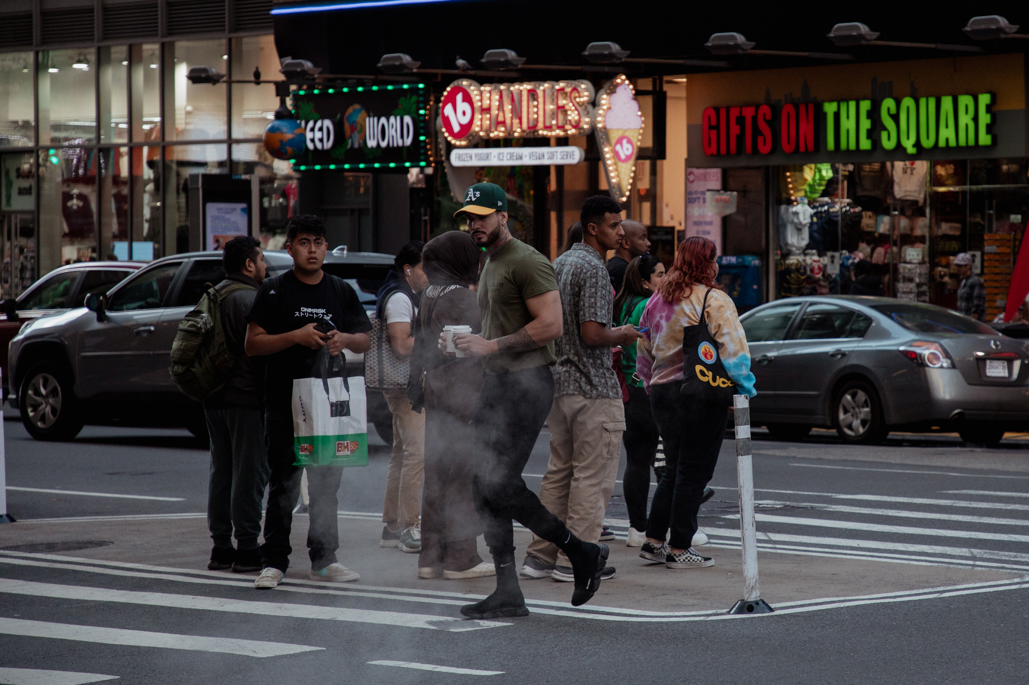 Times Square street scene with pedestrians and neon storefronts photographed by Karmil Studios