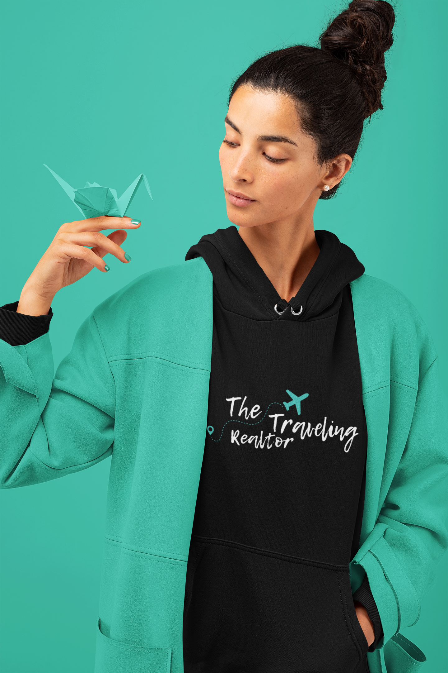 Black hoodie featuring The Traveling Realtor logo with airplane graphic and handwritten typography